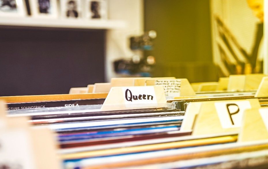 An image of a record collection sorted alphabetically. You can see labels for "P", "N", "Z", and the name "Queen".
