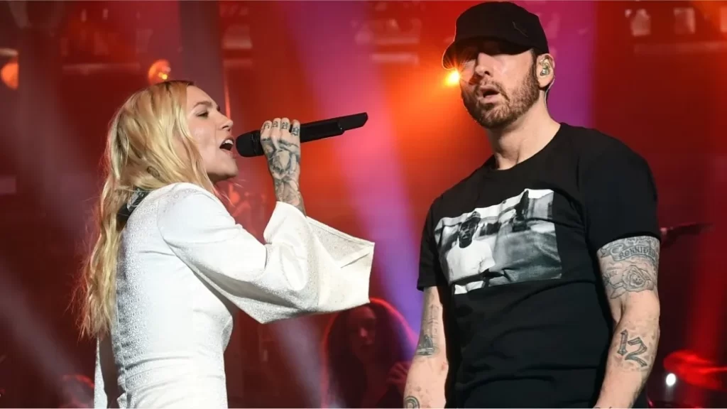 Skyler Grey and Eminem performing together, via Getty Images